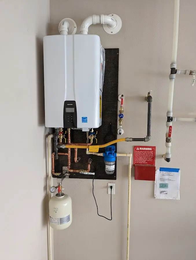 Professional plumber installing copper piping in a Lodi home